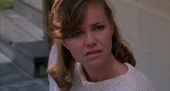 Movie still from “Smokey and the Bandit II” (1980), directed by Hal Needham – A person wearing a sweater; Close Up shot, Over the shoulder angle