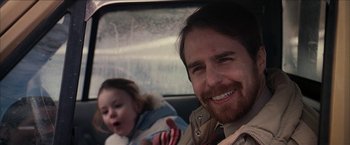 Movie still from “Snow Angels” (2007), directed by David Gordon Green – A man and a little girl in the back of a car; Close Up shot, Over the shoulder angle