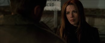 Movie still from “Snow Angels” (2007), directed by David Gordon Green – A woman with red hair is looking at a man with red hair; Close Up shot, Over the shoulder angle