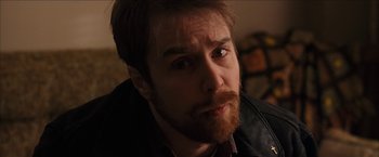 Movie still from “Snow Angels” (2007), directed by David Gordon Green – A person with a beard; Close Up shot, High angle