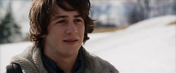 Movie still from “Snow Angels” (2007), directed by David Gordon Green – A person with long hair; Close Up shot, Over the shoulder angle