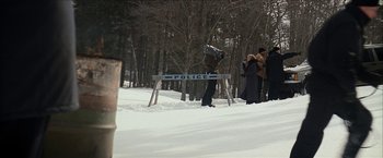 Movie still from “Snow Angels” (2007), directed by David Gordon Green – A police barricade in the middle of a snow covered forest; Extreme Wide shot, High angle