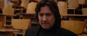 Movie still from “Snow Angels” (2007), directed by David Gordon Green – A person sitting in a chair; Close Up shot, Low angle