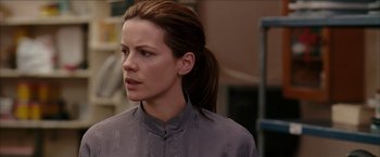 Movie still from “Snow Angels” (2007), directed by David Gordon Green – A person with a ponytail; Close Up shot, Over the shoulder angle