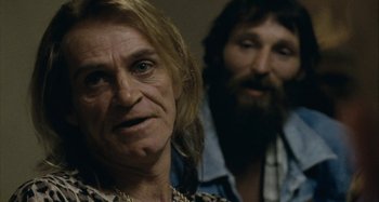 Movie still from “The Snowtown Murders” (2011), directed by Justin Kurzel – A man and a woman are standing next to each other; Close Up shot, Over the shoulder angle