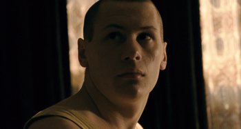 Movie still from “The Snowtown Murders” (2011), directed by Justin Kurzel – A person looking at the camera; Close Up shot, Low angle