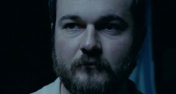 Movie still from “The Snowtown Murders” (2011), directed by Justin Kurzel – A person with a beard; Close Up shot, Low angle