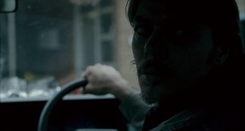 Movie still from “The Snowtown Murders” (2011), directed by Justin Kurzel – A person holding a steering wheel; Close Up shot, Over the shoulder angle