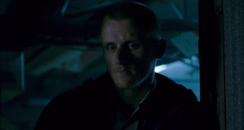 Movie still from “The Snowtown Murders” (2011), directed by Justin Kurzel – A person in a dark room; Close Up shot, Low angle