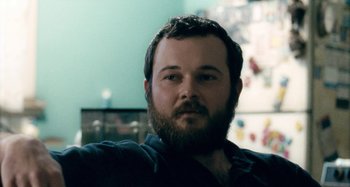 Movie still from “The Snowtown Murders” (2011), directed by Justin Kurzel – A man with a goatee and a beard; Close Up shot, Low angle