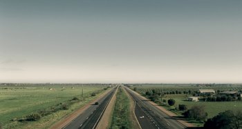 Movie still from “The Snowtown Murders” (2011), directed by Justin Kurzel – An image of an empty highway in the middle of the day; Extreme Wide shot, High angle