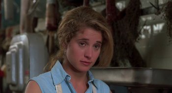 Movie still from “So I Married an Axe Murderer” (1993), directed by Thomas Schlamme – A person wearing a blue shirt; Close Up shot, Over the shoulder angle