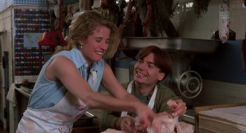 Movie still from “So I Married an Axe Murderer” (1993), directed by Thomas Schlamme – A man and a woman are preparing food in a kitchen; Medium shot, High angle