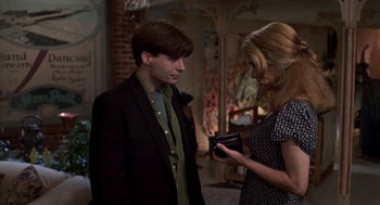 Movie still from “So I Married an Axe Murderer” (1993), directed by Thomas Schlamme – A man and a woman looking at each other in a room; Medium shot, Over the shoulder angle