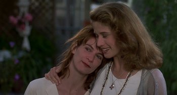 Movie still from “So I Married an Axe Murderer” (1993), directed by Thomas Schlamme – A couple of women hugging each other in a room; Close Up shot, Low angle