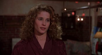 Movie still from “So I Married an Axe Murderer” (1993), directed by Thomas Schlamme – A person with curly hair; Close Up shot, Over the shoulder angle