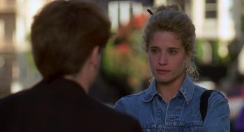 Movie still from “So I Married an Axe Murderer” (1993), directed by Thomas Schlamme – A woman in a jean jacket talking to a man in a black shirt; Close Up shot, Over the shoulder angle