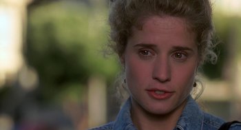 Movie still from “So I Married an Axe Murderer” (1993), directed by Thomas Schlamme – A person wearing a jean jacket; Close Up shot, Over the shoulder angle