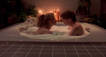 Movie still from “So I Married an Axe Murderer” (1993), directed by Thomas Schlamme – A man and a woman are in a bath tub; Medium shot, High angle