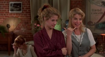 Movie still from “So I Married an Axe Murderer” (1993), directed by Thomas Schlamme – Two young women are standing in front of a brick wall; Medium shot, High angle