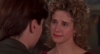 Movie still from “So I Married an Axe Murderer” (1993), directed by Thomas Schlamme – A young woman is looking at a young man; Close Up shot, Over the shoulder angle