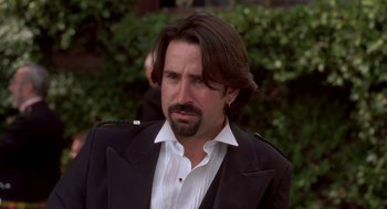 Movie still from “So I Married an Axe Murderer” (1993), directed by Thomas Schlamme – A person wearing a suit and beard; Close Up shot, Low angle