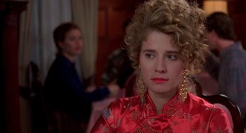 Movie still from “So I Married an Axe Murderer” (1993), directed by Thomas Schlamme – A person wearing a red dress; Close Up shot, Over the shoulder angle