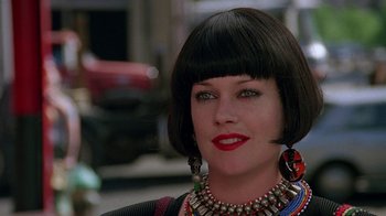 Movie still from “Something Wild” (1986), directed by Jonathan Demme – A person wearing a necklace; Close Up shot, Over the shoulder angle