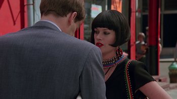 Movie still from “Something Wild” (1986), directed by Jonathan Demme – A man and a woman are talking to each other; Close Up shot, Over the shoulder angle