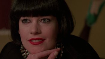 Movie still from “Something Wild” (1986), directed by Jonathan Demme – A person wearing a black jacket; Close Up shot, Over the shoulder angle