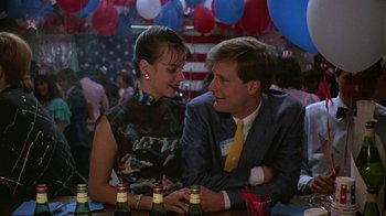 Movie still from “Something Wild” (1986), directed by Jonathan Demme – A man and a woman sitting at a table with drinks; Medium shot, Over the shoulder angle