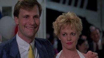 Movie still from “Something Wild” (1986), directed by Jonathan Demme – A man and a woman standing next to each other; Close Up shot, Low angle
