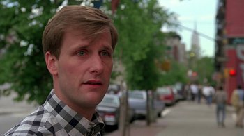 Movie still from “Something Wild” (1986), directed by Jonathan Demme – A person wearing a checkered shirt; Close Up shot, Low angle