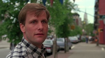 Movie still from “Something Wild” (1986), directed by Jonathan Demme – A person wearing a plaid shirt; Close Up shot, Low angle