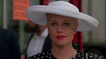 Movie still from “Something Wild” (1986), directed by Jonathan Demme – A person wearing a hat; Close Up shot, Over the shoulder angle