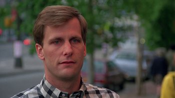 Movie still from “Something Wild” (1986), directed by Jonathan Demme – A person wearing a plaid shirt; Close Up shot, Low angle