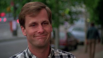 Movie still from “Something Wild” (1986), directed by Jonathan Demme – A person smiling with his eyes closed; Close Up shot, Low angle