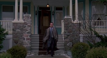 Movie still from “Groundhog Day” (1993), directed by Harold Ramis – A man walking down the steps of a house; Wide shot, Low angle