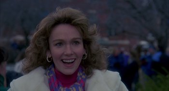 Movie still from “Groundhog Day” (1993), directed by Harold Ramis – A person wearing a jacket and a scarf; Close Up shot, Over the shoulder angle