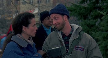 Movie still from “Groundhog Day” (1993), directed by Harold Ramis – A man and a woman talking to each other outside; Medium shot, Over the shoulder angle