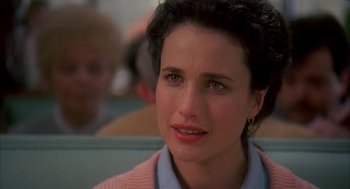 Movie still from “Groundhog Day” (1993), directed by Harold Ramis – A person sitting in a chair; Close Up shot, Over the shoulder angle