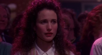 Movie still from “Groundhog Day” (1993), directed by Harold Ramis – A person with curly hair; Close Up shot, Over the shoulder angle