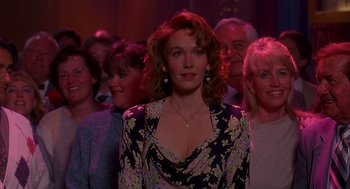 Movie still from “Groundhog Day” (1993), directed by Harold Ramis – A group of people standing in a room; Medium shot, Over the shoulder angle