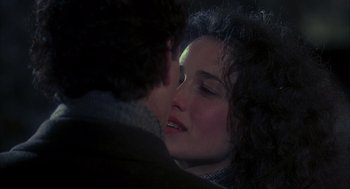 Movie still from “Groundhog Day” (1993), directed by Harold Ramis – A man and a woman kissing; Close Up shot, Over the shoulder angle