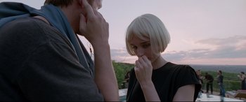 Movie still from “Song to Song” (2017), directed by Terrence Malick – A man and a woman standing next to each other outside; Close Up shot, Over the shoulder angle