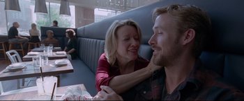 Movie still from “Song to Song” (2017), directed by Terrence Malick – A man and a woman sitting in a booth; Close Up shot, Over the shoulder angle