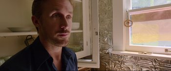 Movie still from “Song to Song” (2017), directed by Terrence Malick – A person in front of a mirror; Close Up shot, Over the shoulder angle