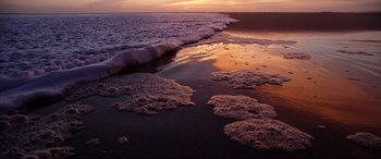 Movie still from “Song to Song” (2017), directed by Terrence Malick – A body of water that has some water on it; Extreme Wide shot, High angle