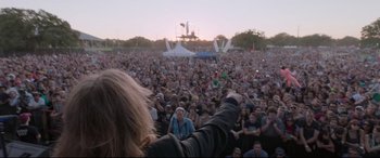 Movie still from “Song to Song” (2017), directed by Terrence Malick – A crowd of people at an outdoor concert; Wide shot, High angle
