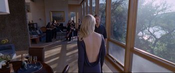 Movie still from “Song to Song” (2017), directed by Terrence Malick – A woman standing in front of a man in front of a string quartet; Wide shot, Over the shoulder angle